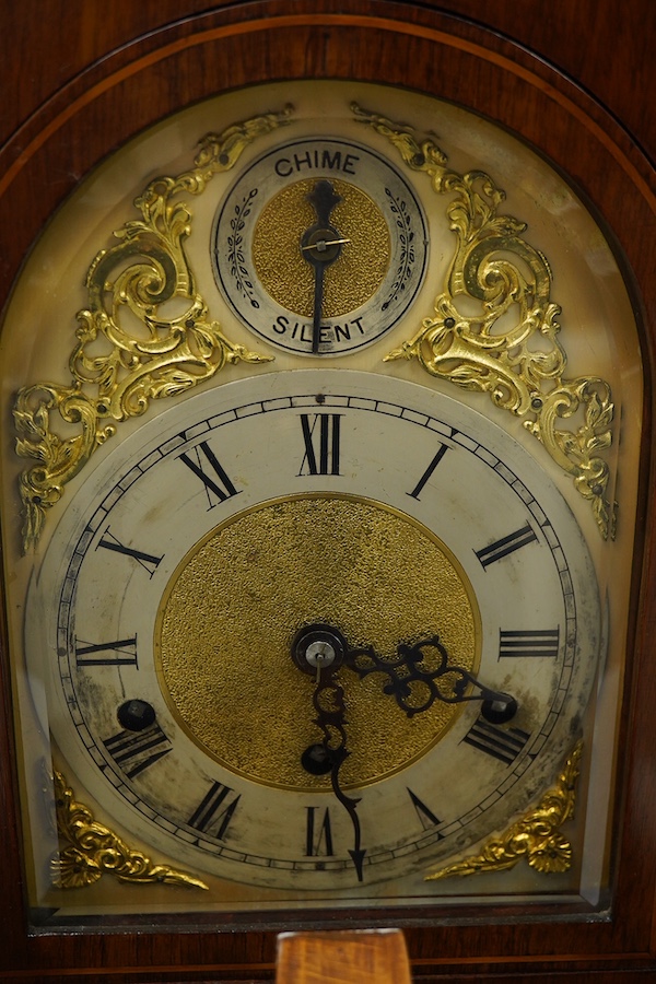 An Edwardian three train mahogany bracket clock and bracket, chiming on four coiled gongs, clock 42.5cm high. Condition - good